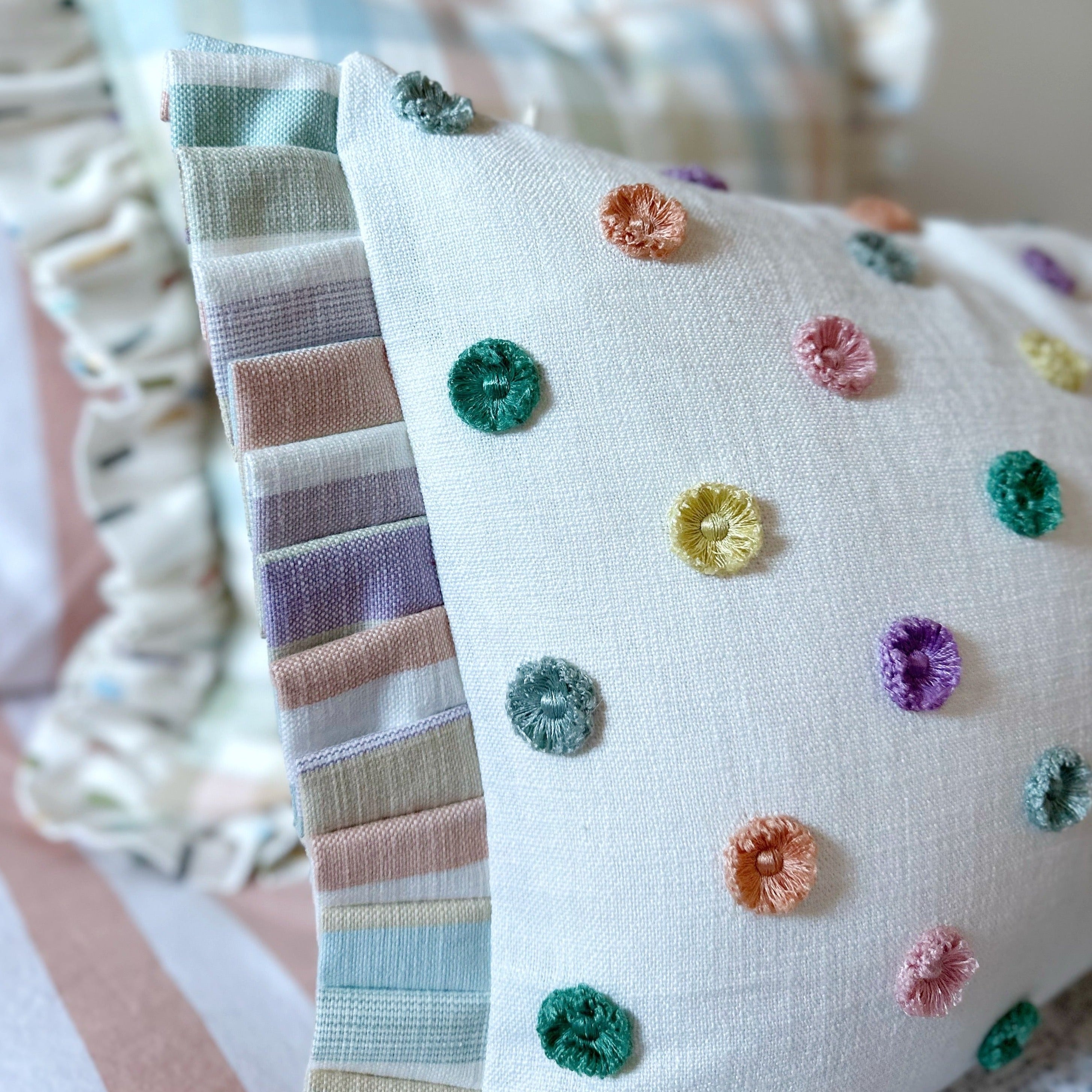 Multi pom cushion with ruffle