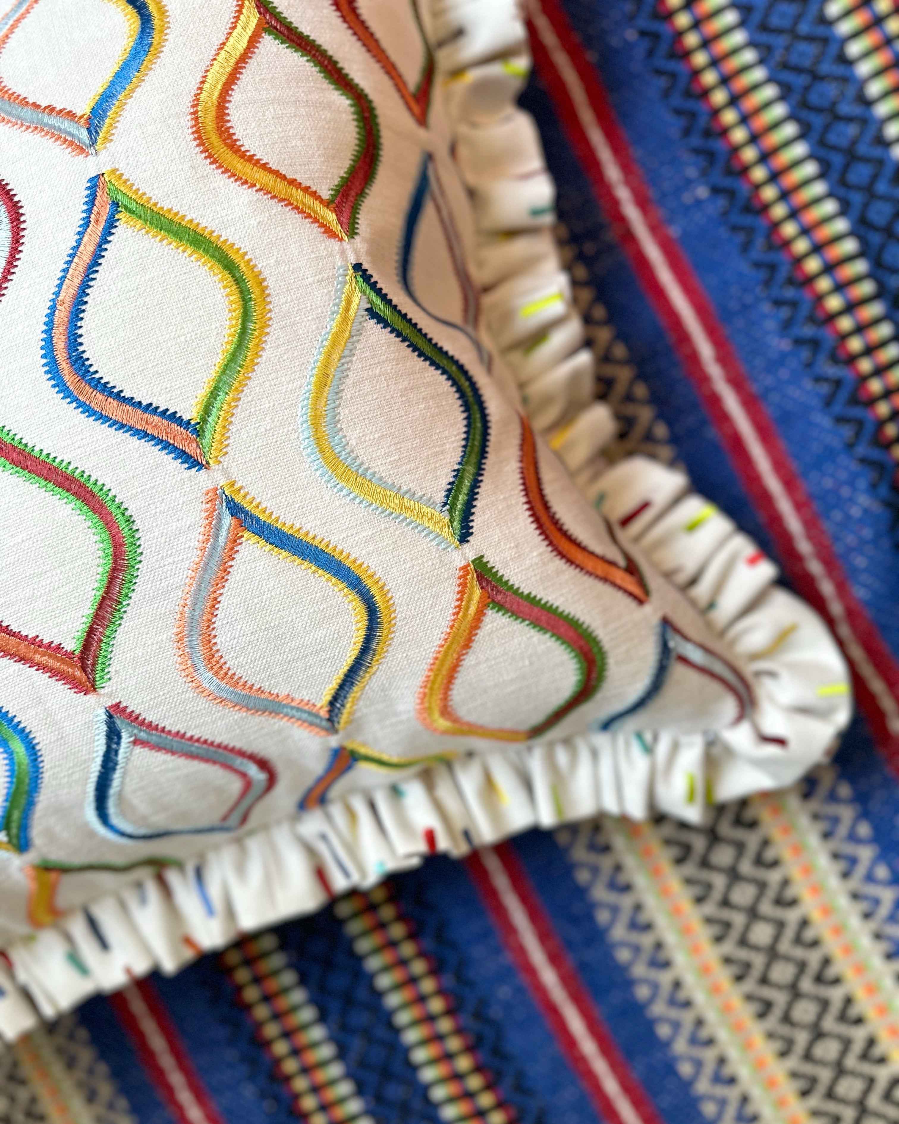 Multi embroidered cushion cover with ruffle